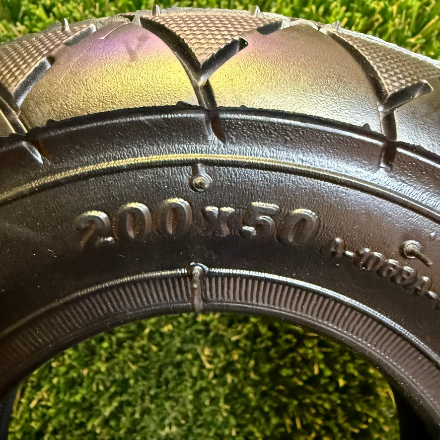 Close-up of the 200x50 size marking and tread on a HOTA A-1068A road tyre.