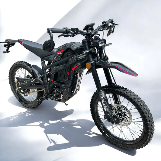 Talaria Sting PRO L1e electric motorbike parked in sunlight, showing its mirrors, indicators and off-road tyres.